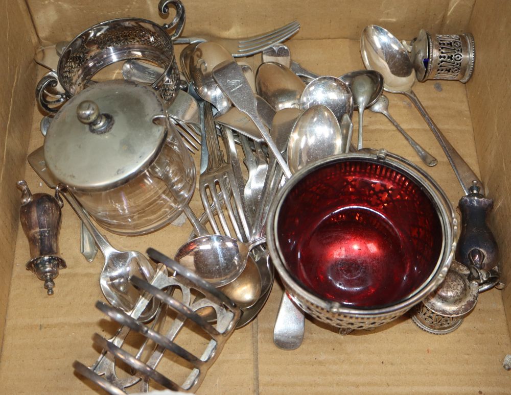 Assorted plated flatware including a sugar basket, a toastrack, condiments etc.